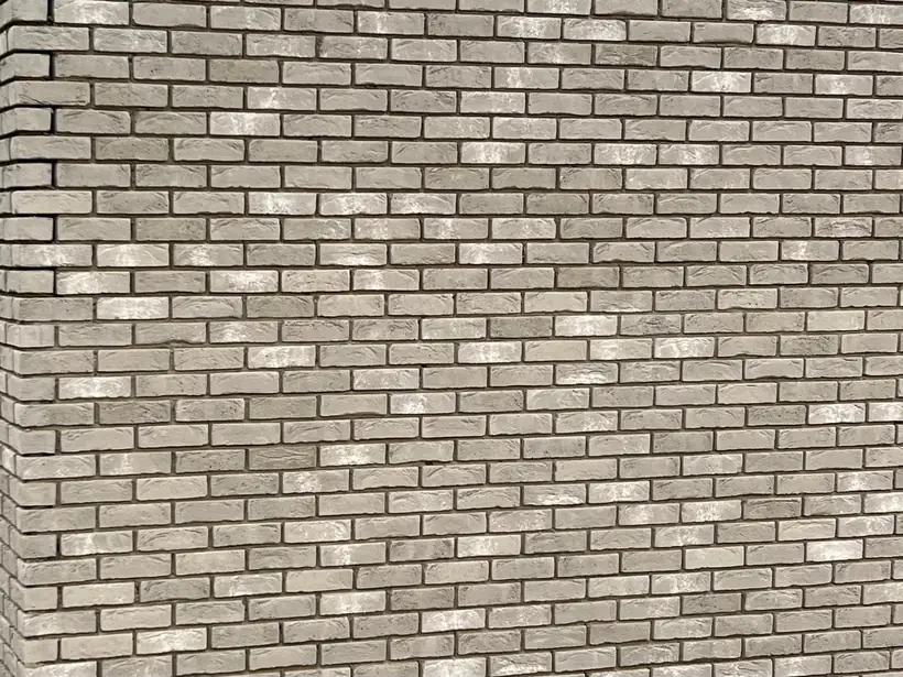 Pan de mur en brique de parement claire, appareillage régulier